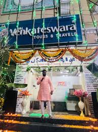a person stands in font of sri venkateswara tours & travels, it is one of the best travel agents in hyderabad.